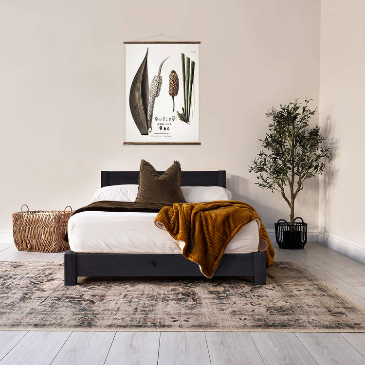 Black stain finish on a wooden bed frame
